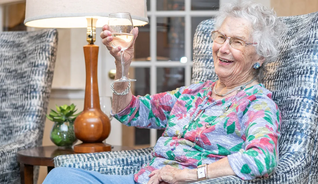 resident enjoying a glass of wine